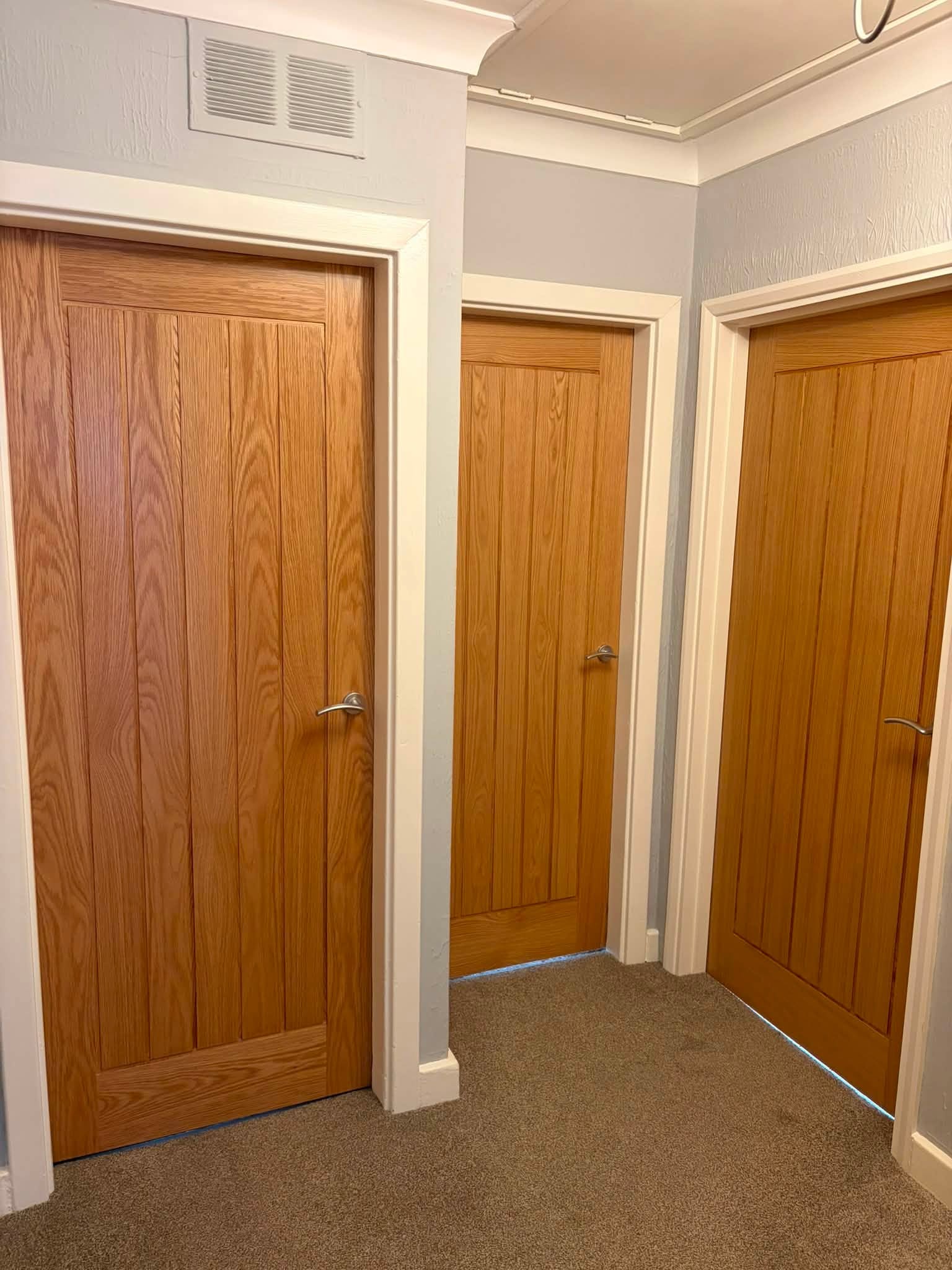Hallway, three oak doors